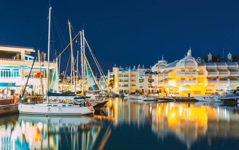Benalmadena, Spain. Night Scenery View Of Floating Houses, Vessel In Puerto Marina. Malaga Region